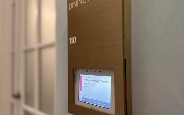 electronic door sign for a meeting room that reads Keller Center Advisory Council